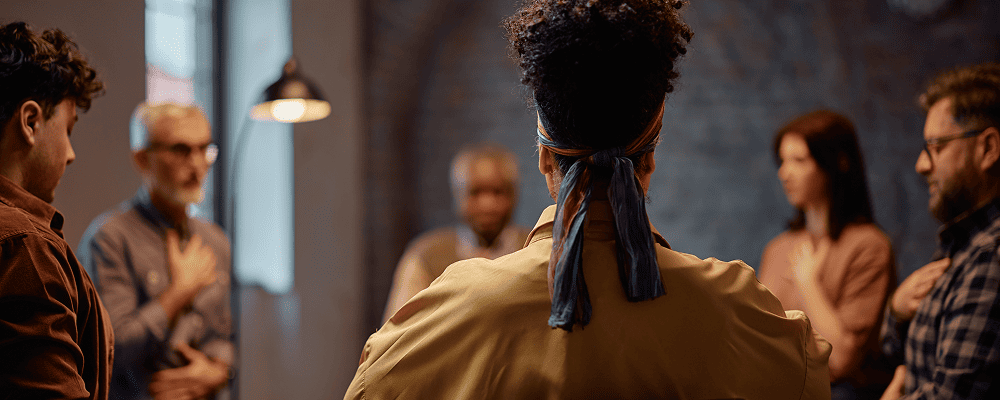 rear view of woman in therapy group | Cornerstone Health & Wellness Clinic